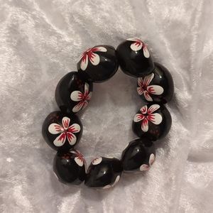 Kukui Nut Bracelet with White Flowers and Red Accents